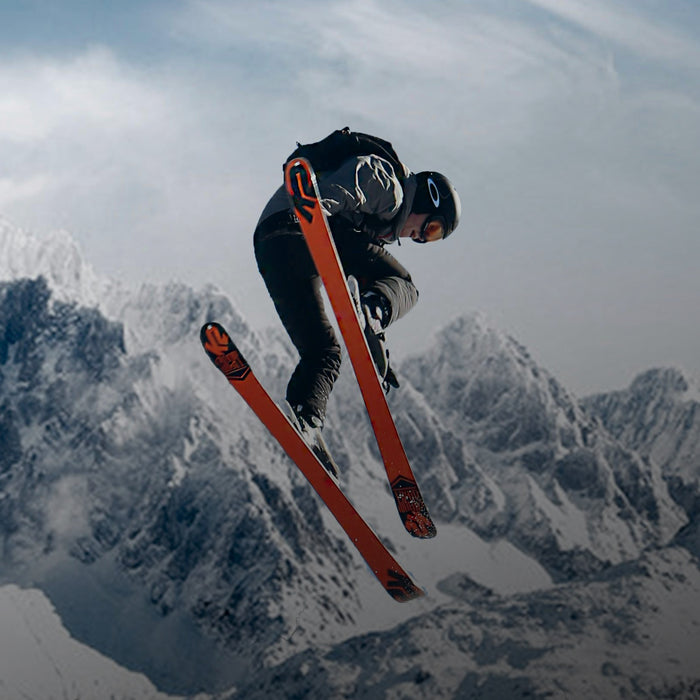 person doing a jump while skiing after taking Kanin energy drink for energy boost so they can perform their best during a race